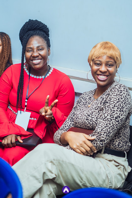 Two attendees smiling at a past FutureHER event